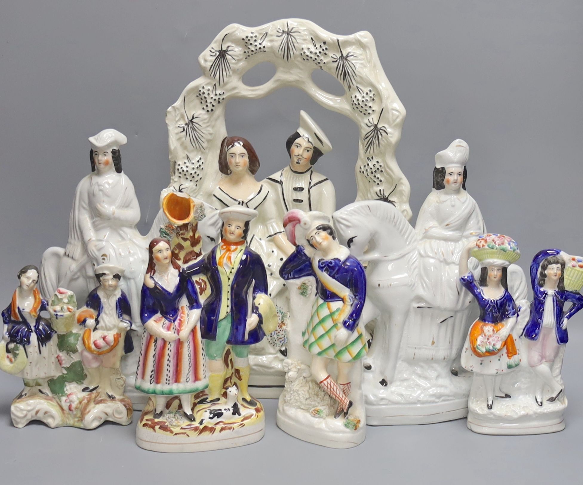 A group of seven Staffordshire pottery flatbacks, tallest 36 cm